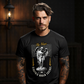 Tattooed male model in dark setting wearing black Seraphius gothic angel oversized streetwear t-shirt by Project Hood